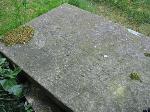 Top half of a flat slab, showing inscription